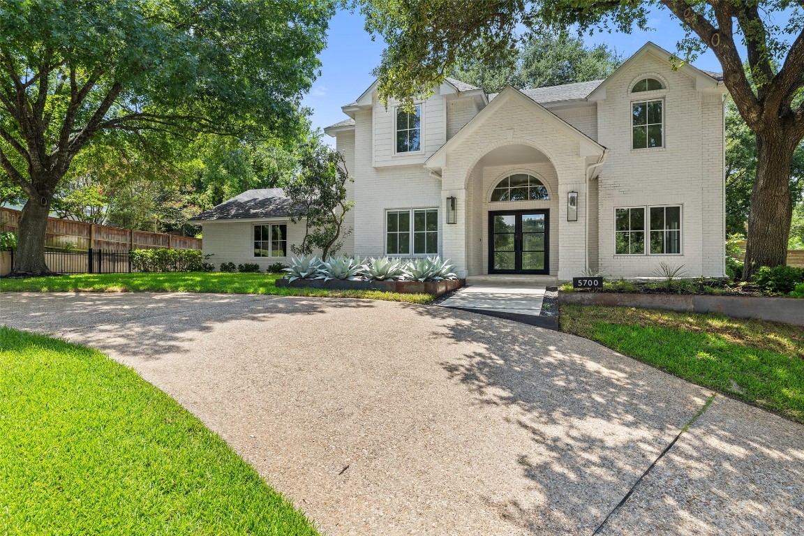 5700 Carry Back Lane Austin, TX 78746 - Photo 2 of 40 a large white building with a outdoor space
