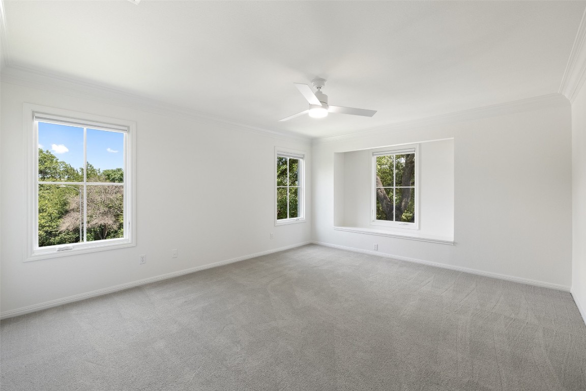5700 Carry Back Lane Austin, TX 78746 - Photo 30 of 40 an empty room with windows and closet