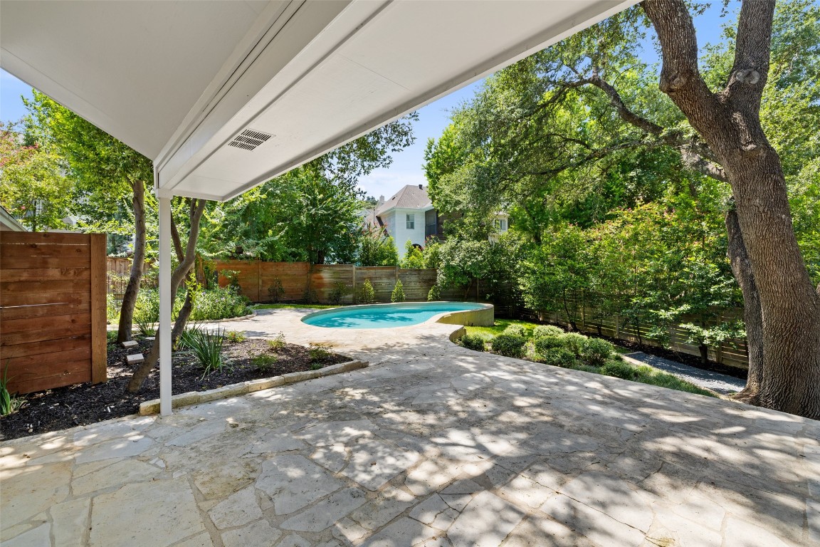 5700 Carry Back Lane Austin, TX 78746 - Photo 38 of 40 a view of backyard with plants and outdoor seating