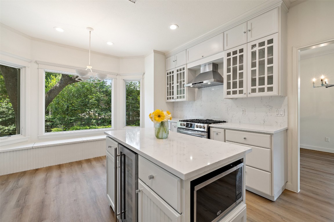 5700 Carry Back Lane Austin, TX 78746 - Photo 7 of 40 a kitchen with stainless steel appliances granite countertop a stove a sink and a refrigerator