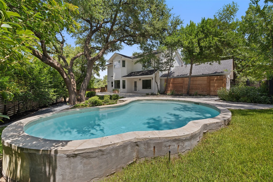 5700 Carry Back Lane Austin, TX 78746 - Photo 9 of 40 front view of a house with a yard