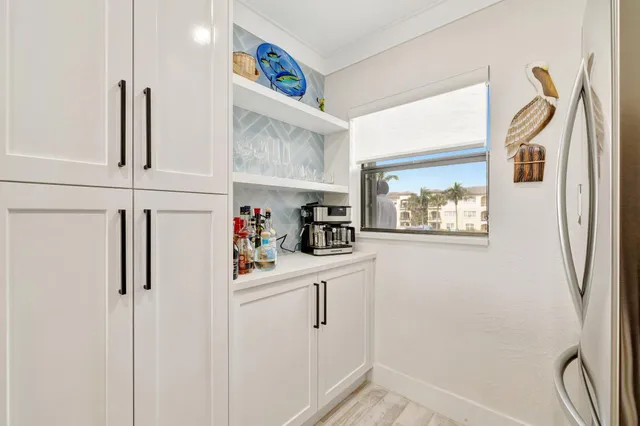 a white refrigerator freezer sitting inside of a kitchen