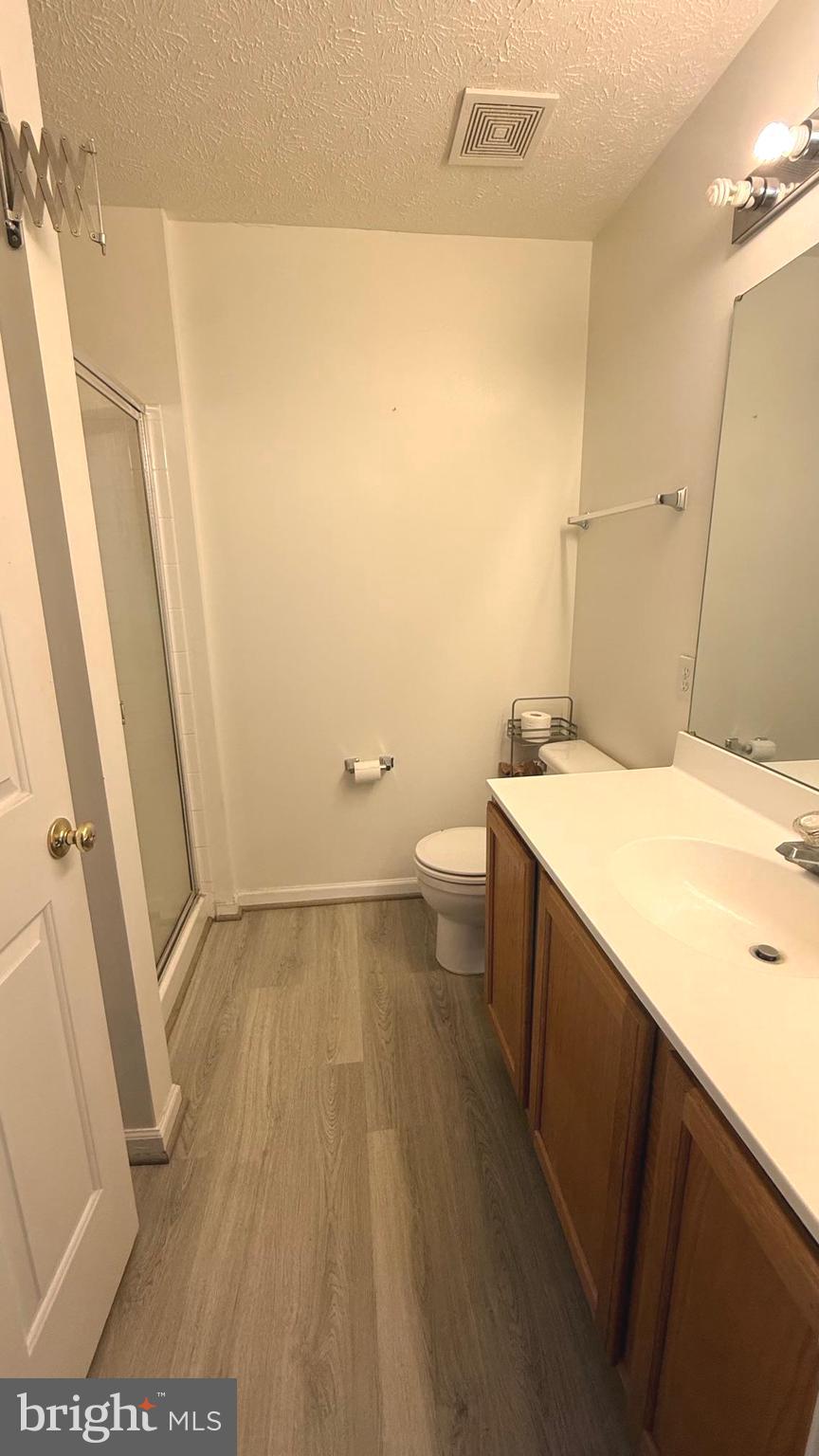 8036 Silver Fox Way Chesapeake Beach, MD 20732 - Photo 11 of 19 a bathroom with a sink and mirror