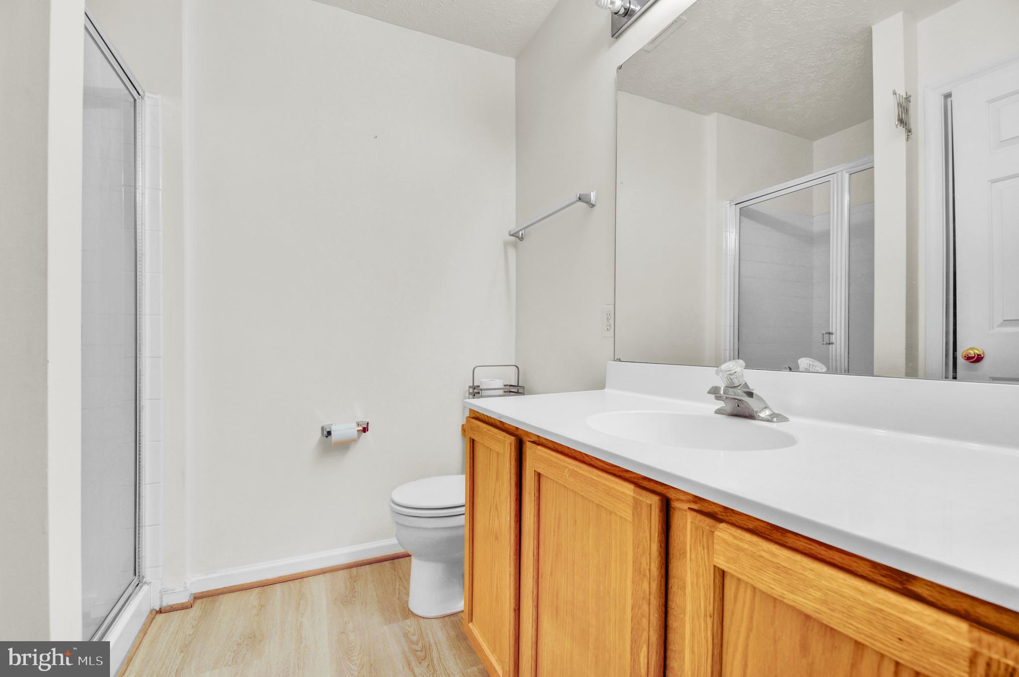 8036 Silver Fox Way Chesapeake Beach, MD 20732 - Photo 13 of 22 a bathroom with a sink and a mirror