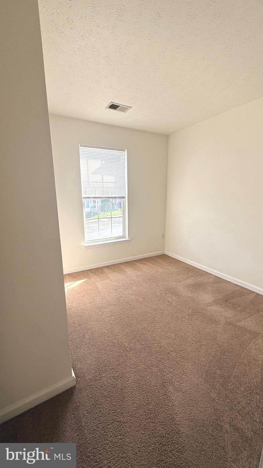 8036 Silver Fox Way Chesapeake Beach, MD 20732 - Photo 14 of 19 an empty room with a window