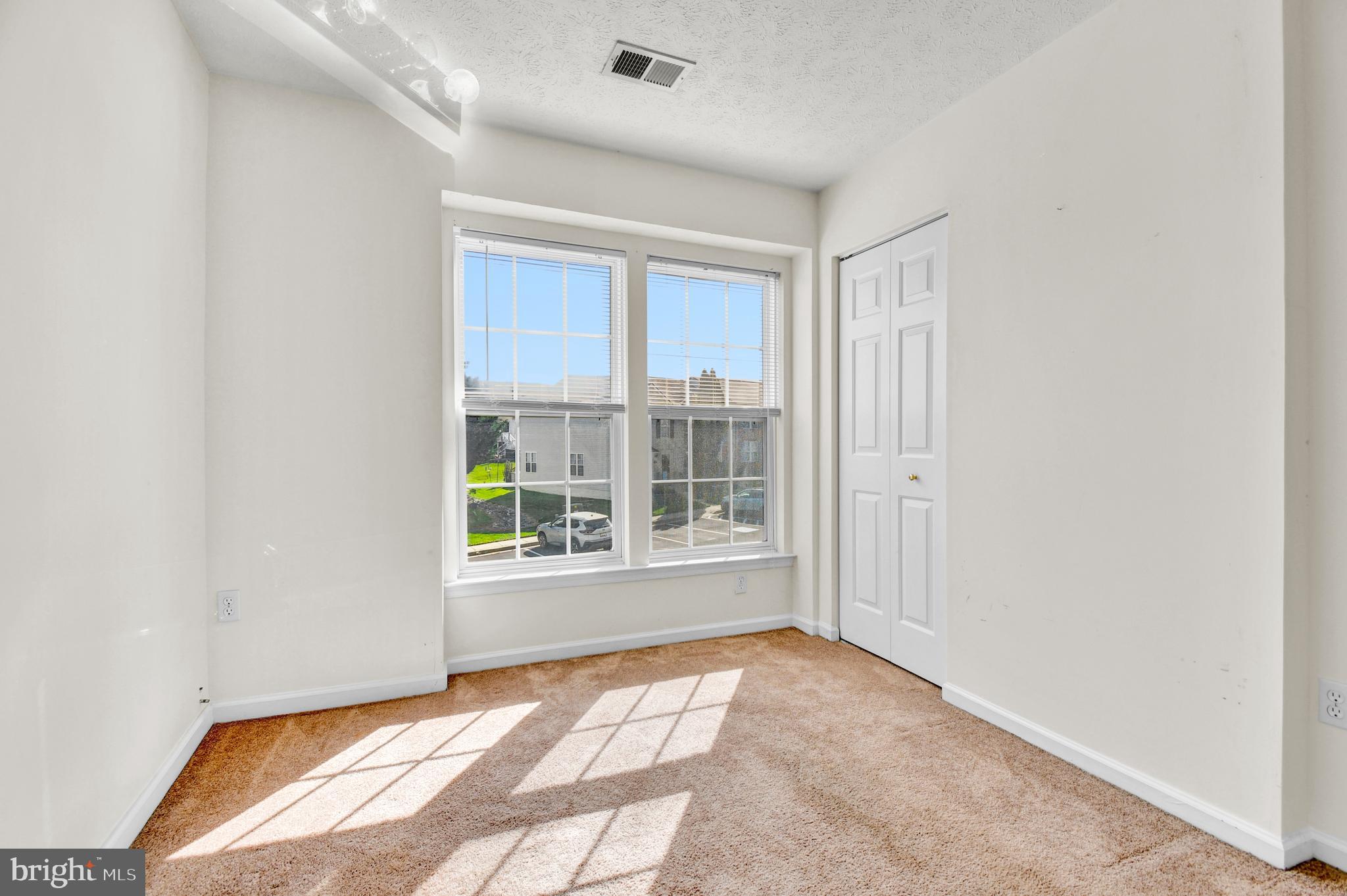 8036 Silver Fox Way Chesapeake Beach, MD 20732 - Photo 14 of 22 a view of an empty room with a window