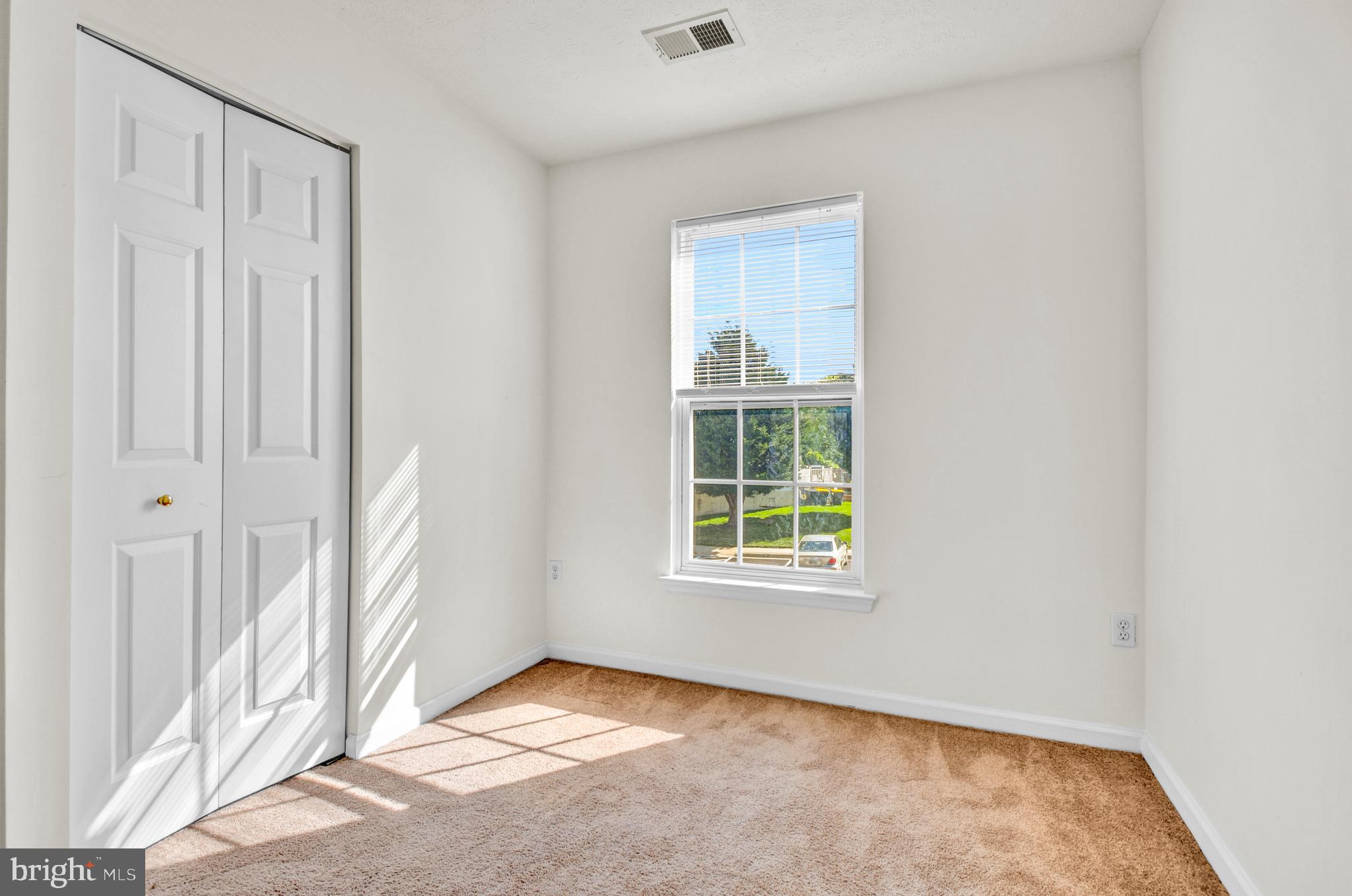 8036 Silver Fox Way Chesapeake Beach, MD 20732 - Photo 16 of 22 an empty room with windows
