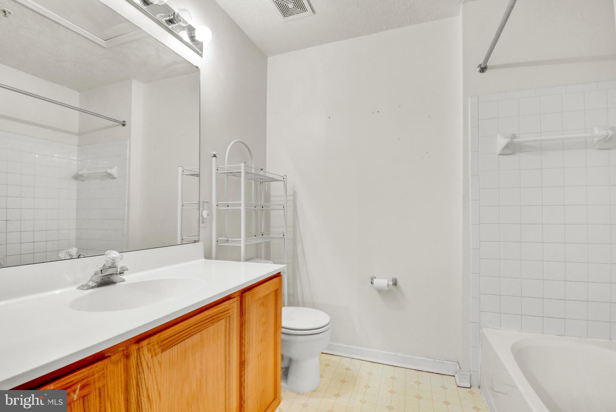 8036 Silver Fox Way Chesapeake Beach, MD 20732 - Photo 17 of 22 a bathroom with a sink a toilet and shower