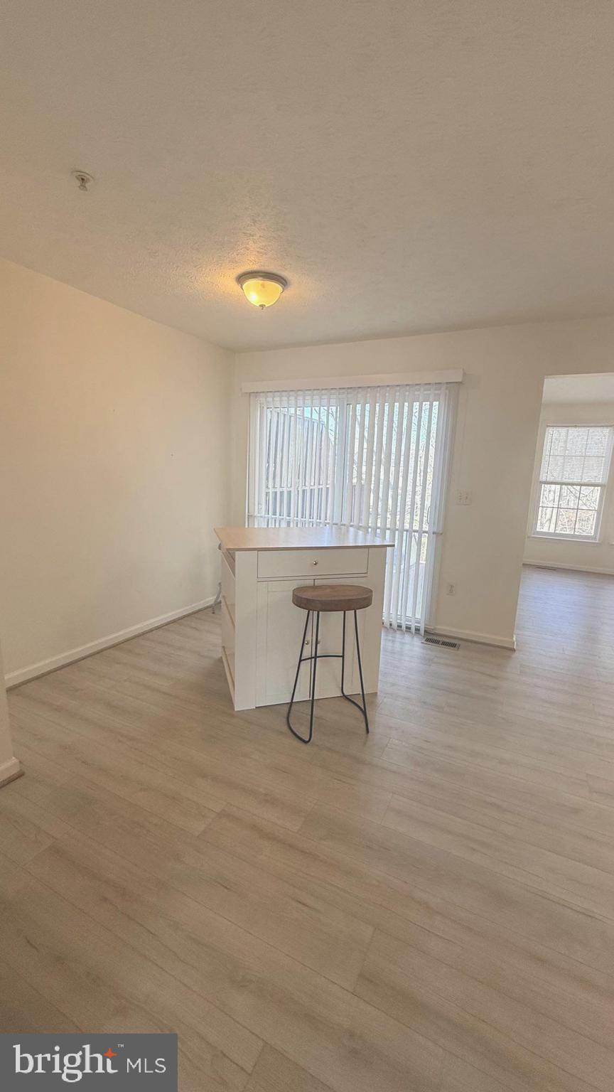 8036 Silver Fox Way Chesapeake Beach, MD 20732 - Photo 6 of 19 a workspace with hardwood wall