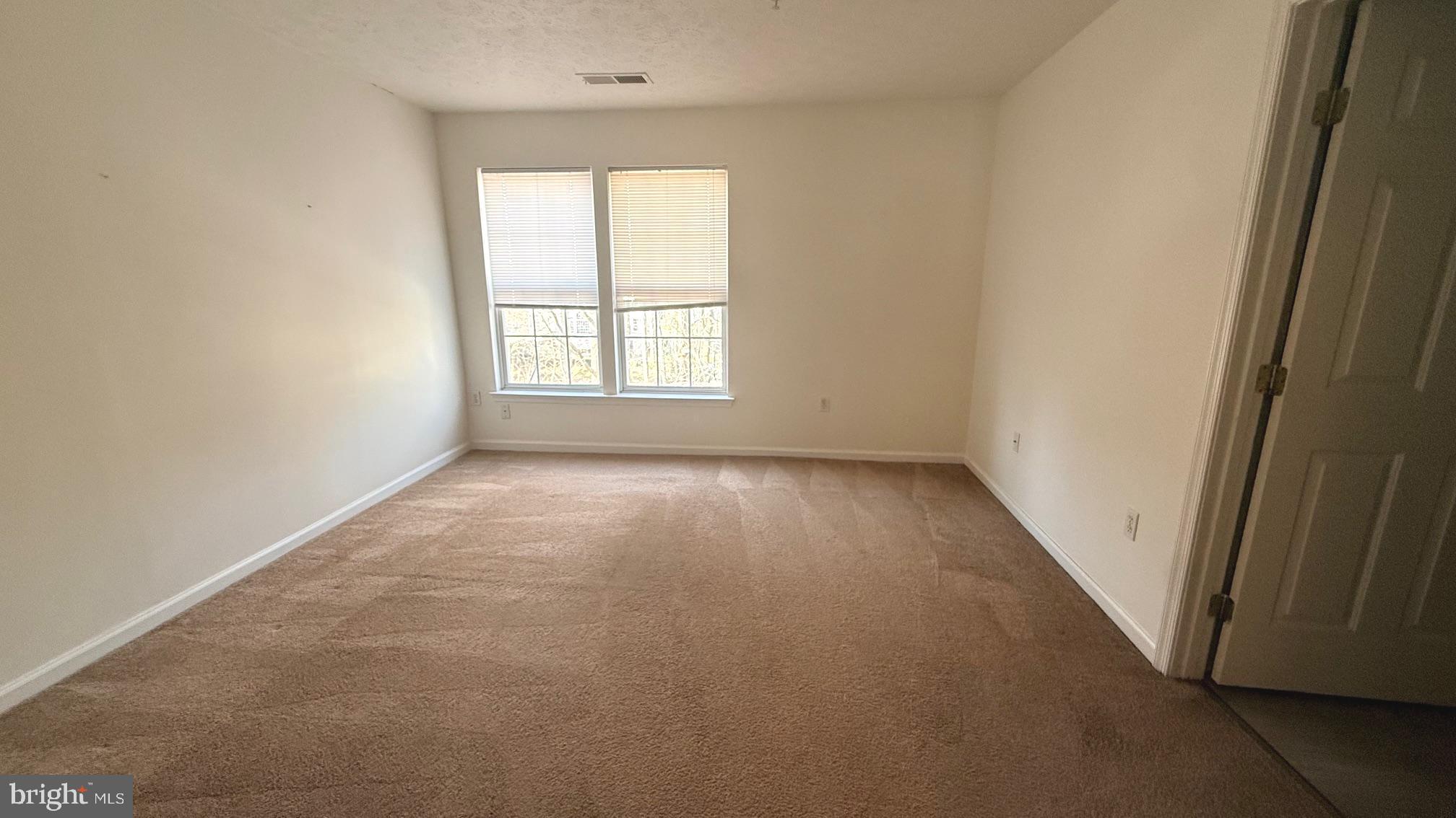 8036 Silver Fox Way Chesapeake Beach, MD 20732 - Photo 9 of 19 an empty room with a window