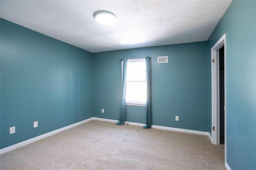 3959 Emerald Springs Court Decatur, GA 30035 - Photo 14 of 27 an empty room with a window