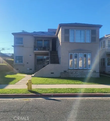a view of house with a swimming pool