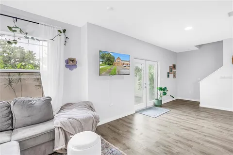 a living room with furniture and a large window