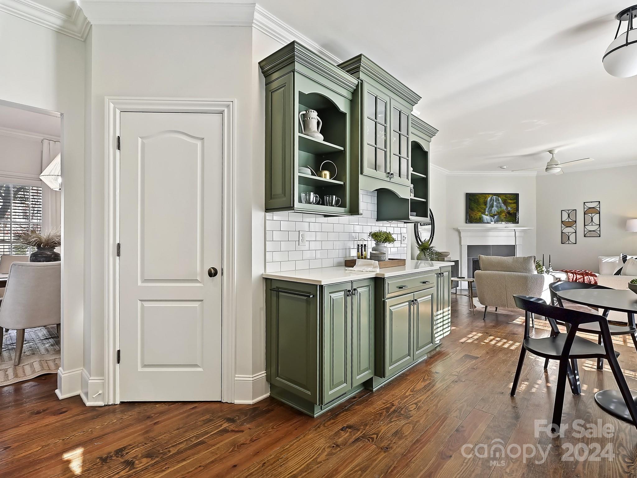 820 Millbrook Road Charlotte, NC 28211 - Photo 11 of 31 a kitchen with a sink cabinets and wooden floor