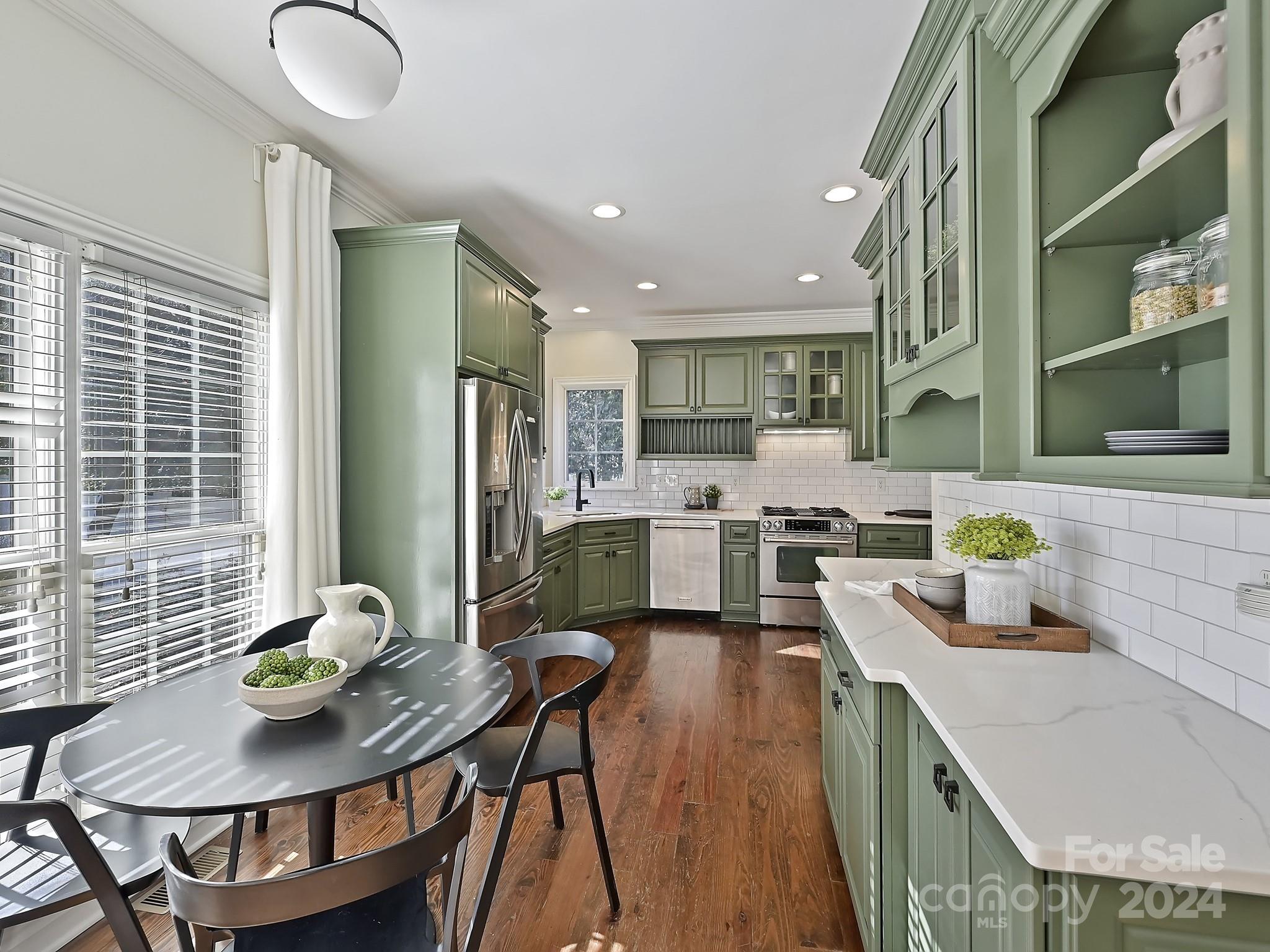 820 Millbrook Road Charlotte, NC 28211 - Photo 12 of 31 a kitchen with a dining table chairs and refrigerator