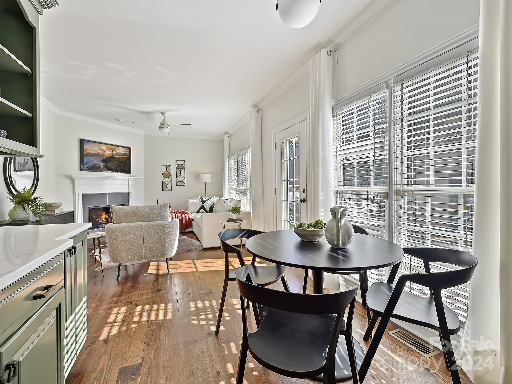 820 Millbrook Road Charlotte, NC 28211 - Photo 13 of 31 a view of a dining room with furniture and wooden floor