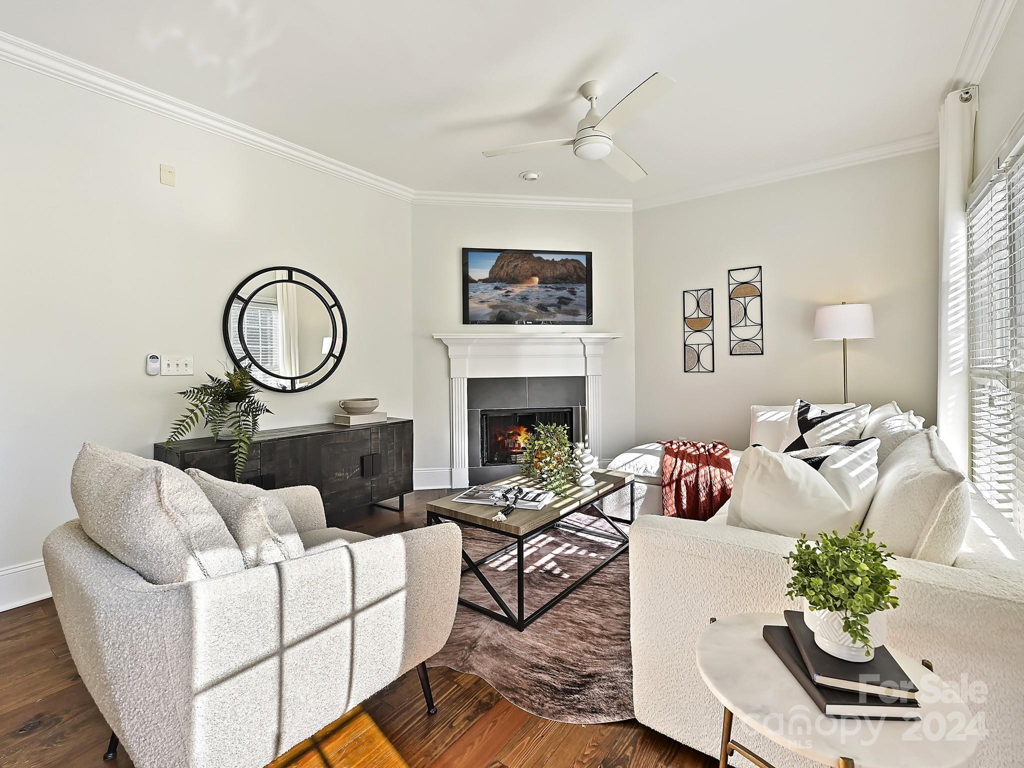 820 Millbrook Road Charlotte, NC 28211 - Photo 15 of 31 a living room with furniture a rug and a fireplace