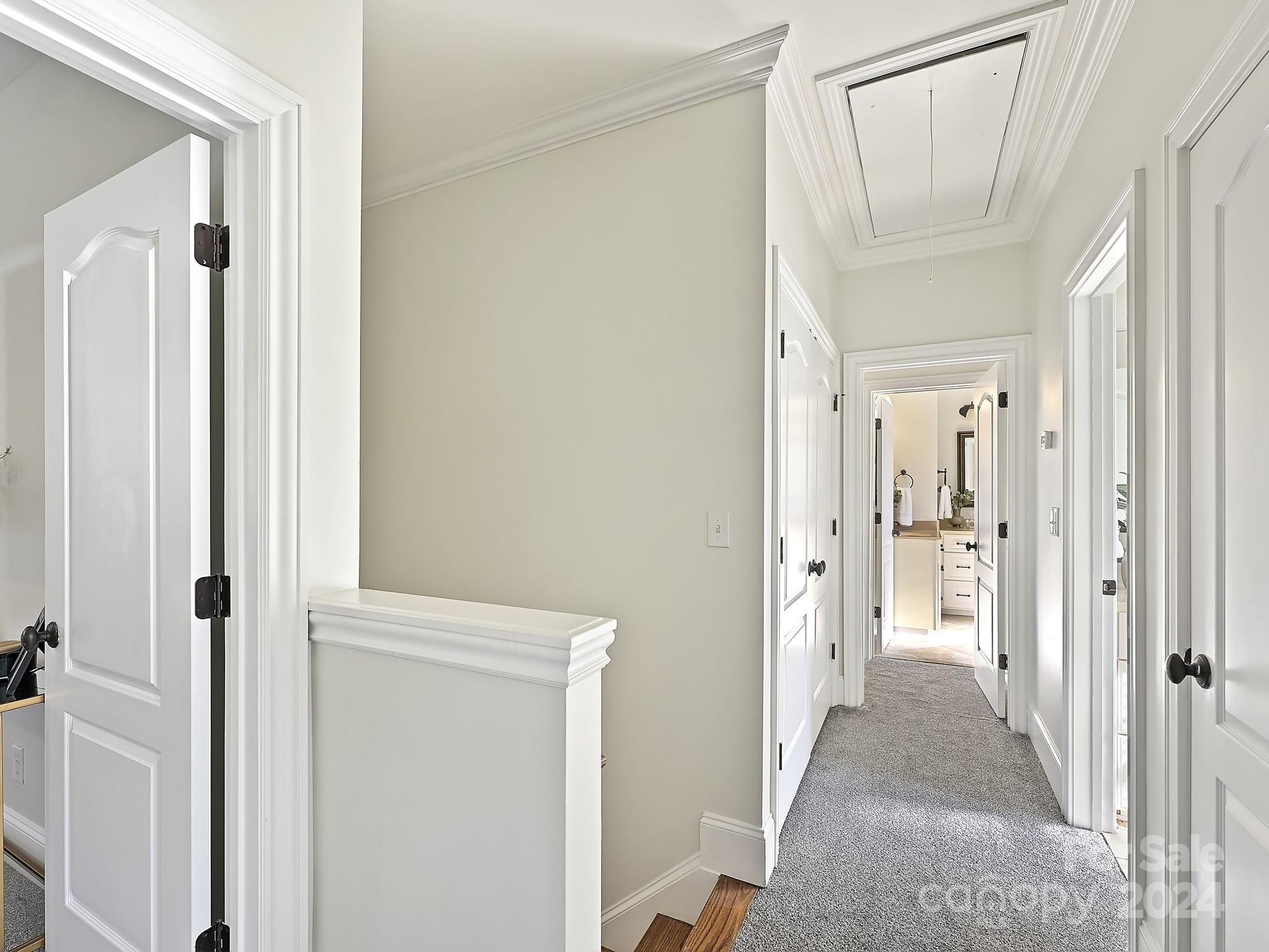 820 Millbrook Road Charlotte, NC 28211 - Photo 18 of 31 a view of a hallway with wooden floor and closet