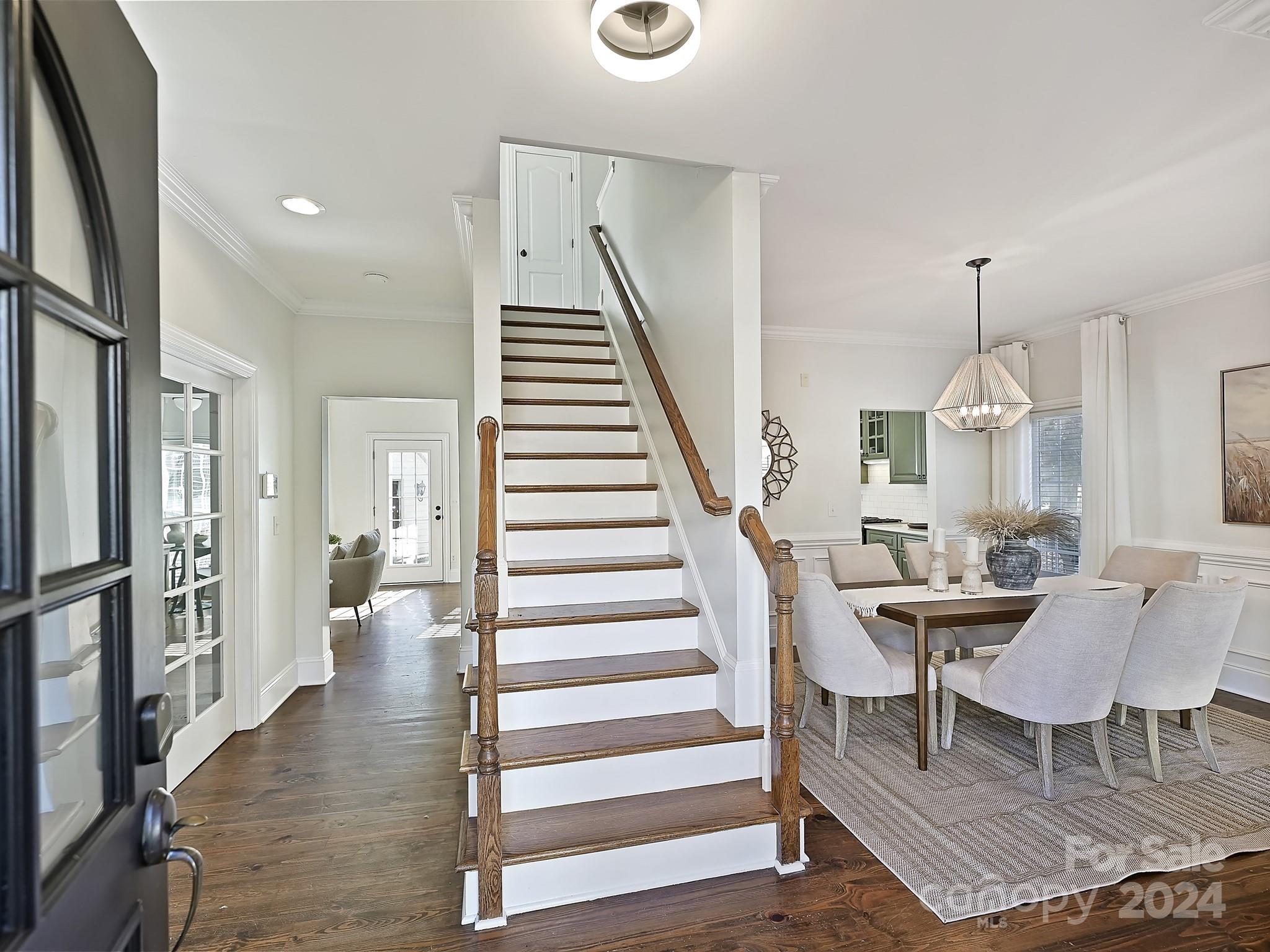 820 Millbrook Road Charlotte, NC 28211 - Photo 2 of 31 a view of a livingroom with furniture and staircase
