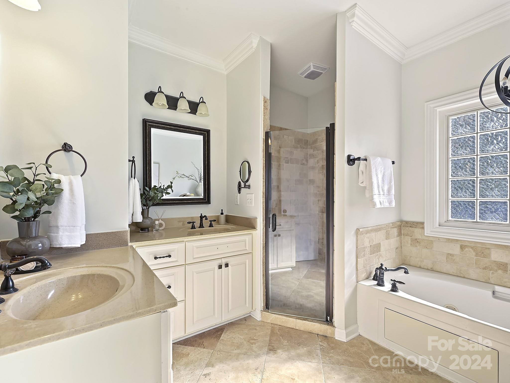820 Millbrook Road Charlotte, NC 28211 - Photo 21 of 31 a bathroom with a tub sink and mirror
