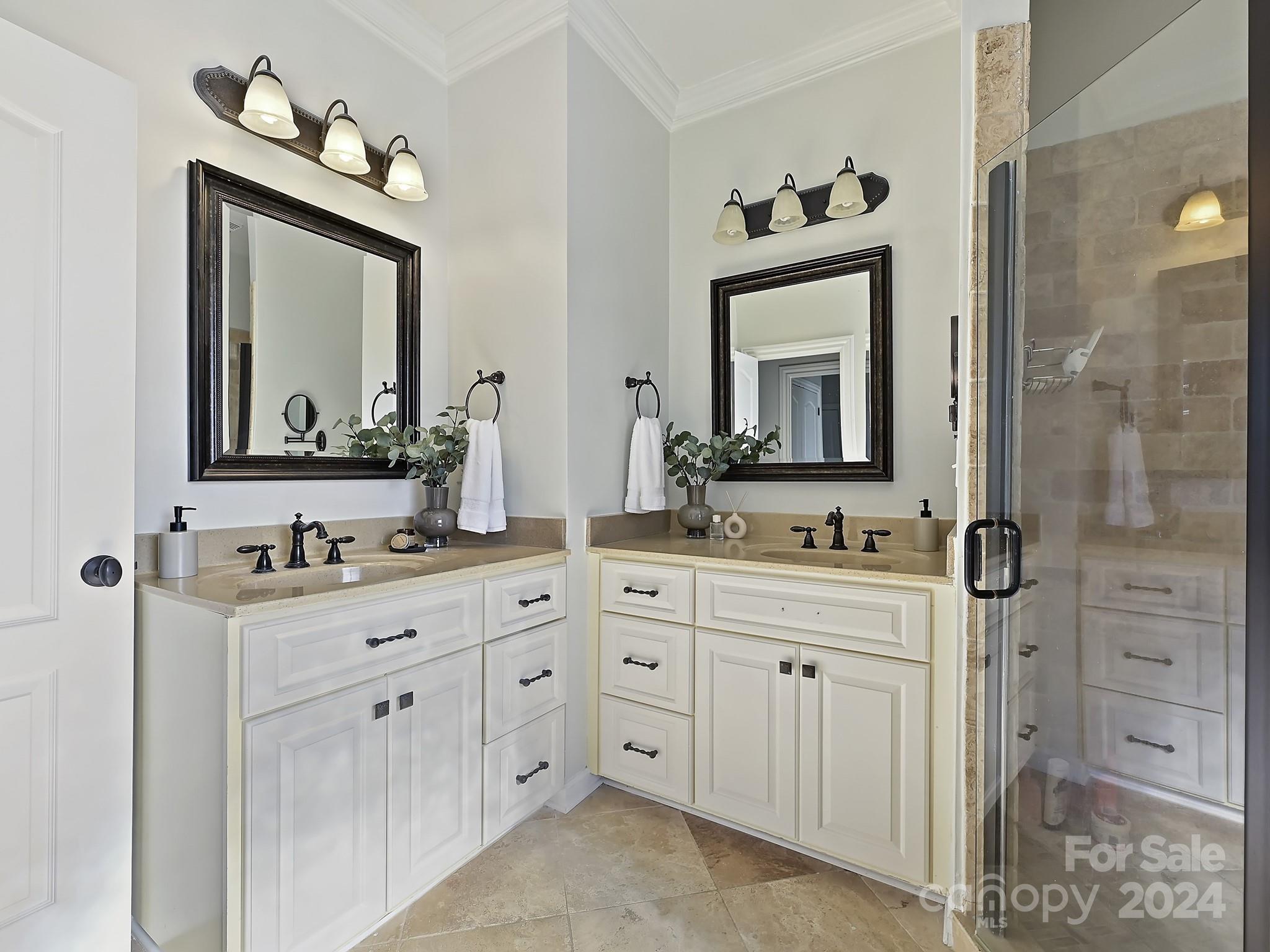 820 Millbrook Road Charlotte, NC 28211 - Photo 23 of 31 a bathroom with a sink a light fixture and a mirror