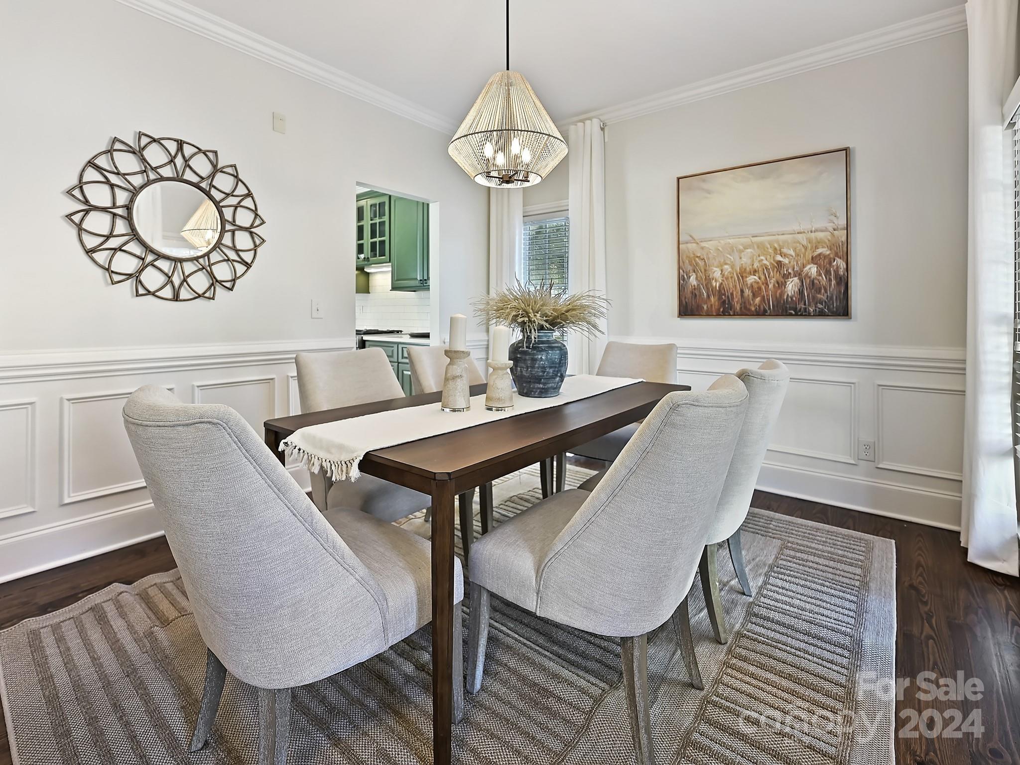 820 Millbrook Road Charlotte, NC 28211 - Photo 3 of 31 a dining room with furniture a rug and wooden floor