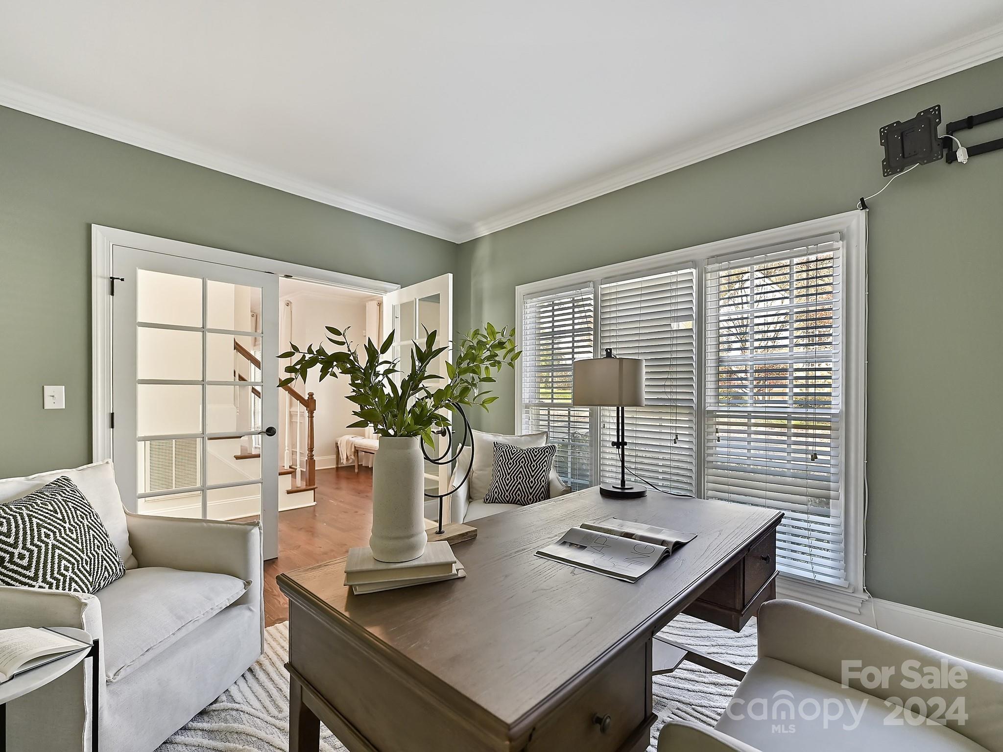 820 Millbrook Road Charlotte, NC 28211 - Photo 7 of 31 a view of a workspace with a table and chair in a room