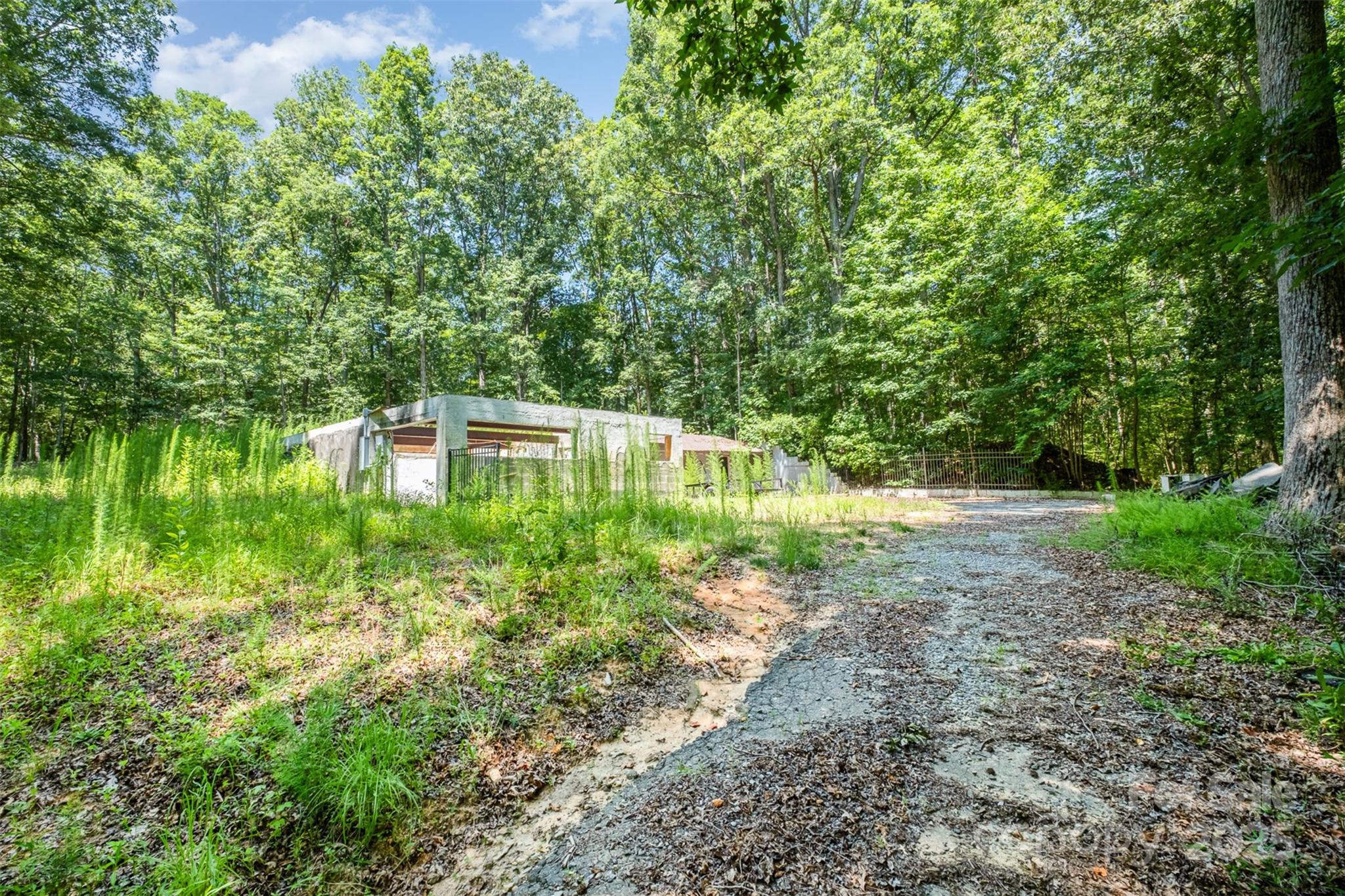 2300 Patterson Road Clover, SC 29710 - Photo 11 of 16 a backyard of a house with lots of green space and lake view