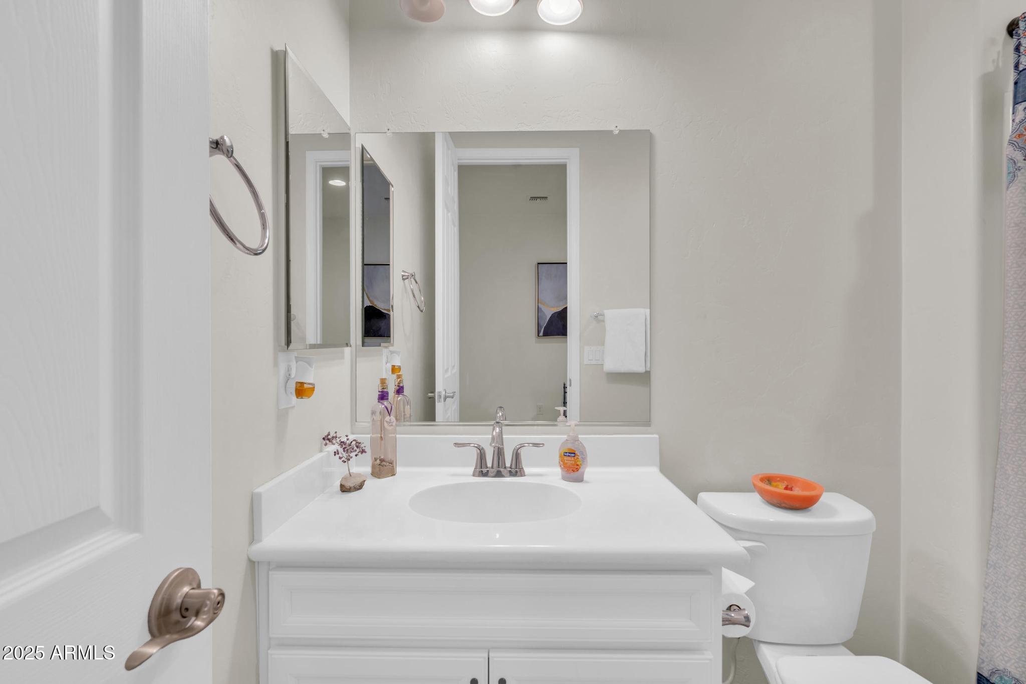 6556 East Via Arroyo Azul Tucson, AZ 85756 - Photo 10 of 75 a bathroom with a sink toilet vanity and tub