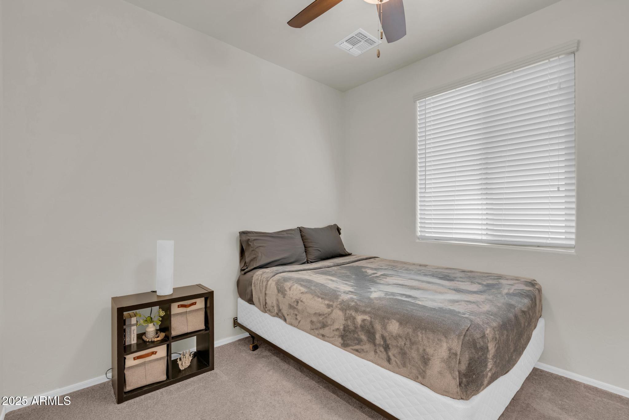6556 East Via Arroyo Azul Tucson, AZ 85756 - Photo 13 of 75 a bedroom with a bed and a window