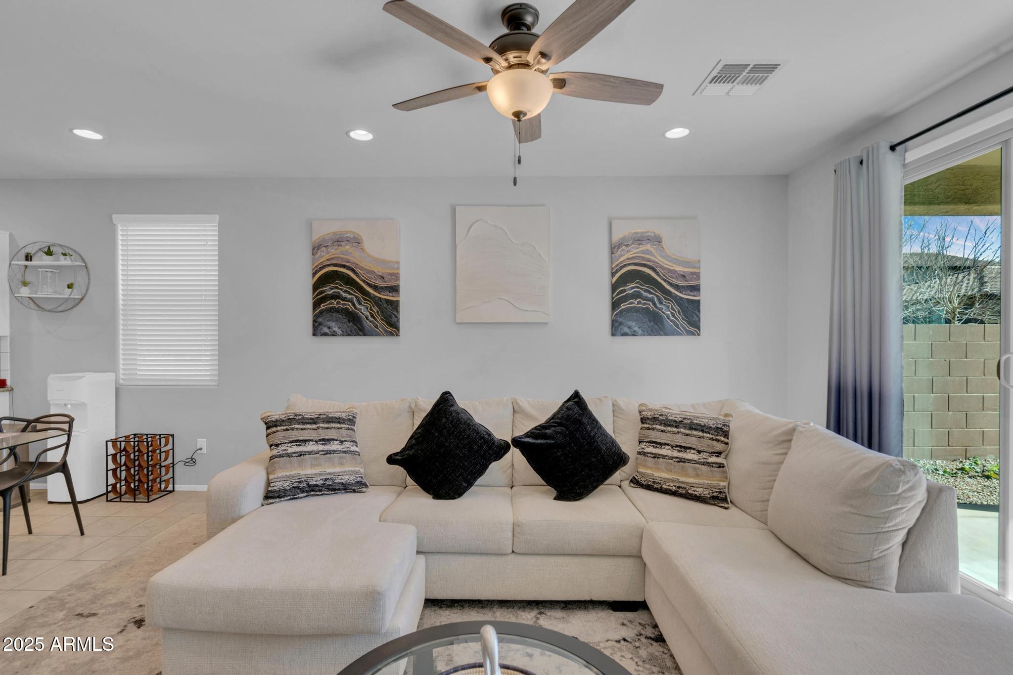 6556 East Via Arroyo Azul Tucson, AZ 85756 - Photo 25 of 75 a living room with furniture and a couch