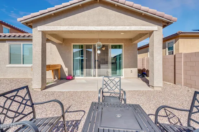 a view of swimming pool with sitting area