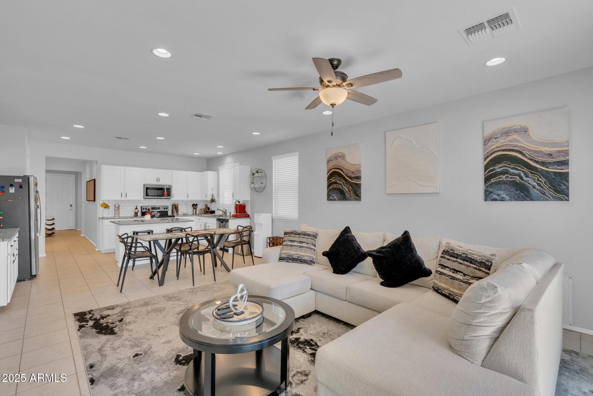 6556 East Via Arroyo Azul Tucson, AZ 85756 - Photo 40 of 75 a living room with furniture and a table