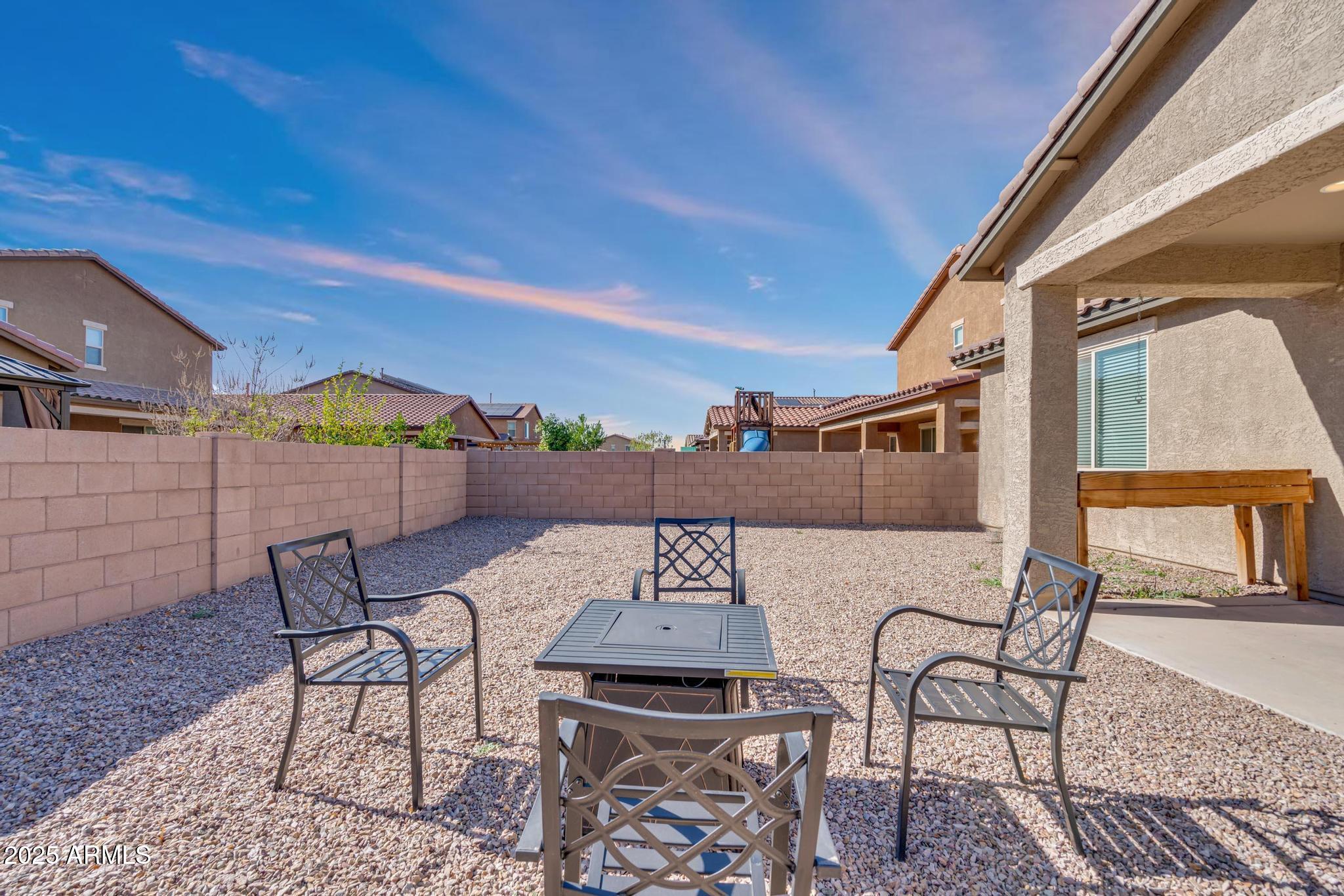 6556 East Via Arroyo Azul Tucson, AZ 85756 - Photo 46 of 75 a view of a terrace with furniture and a table