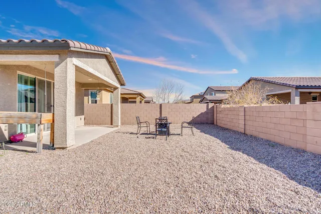 a view of swimming pool with outdoor seating and yard