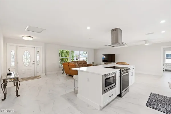 a kitchen with a stove and a wooden floors