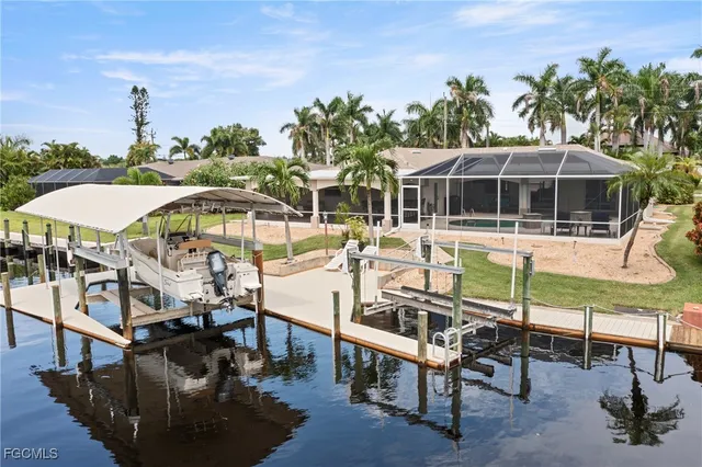 a view of a swimming pool with chairs