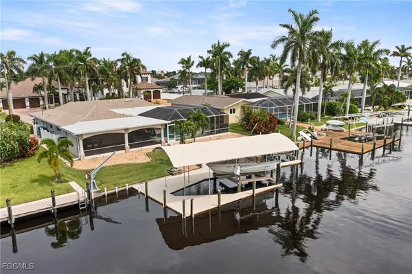a view of a patio with swimming pool table and chairs