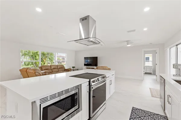 a kitchen with a stove and a microwave