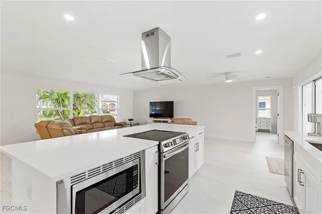 a kitchen with a stove and a microwave