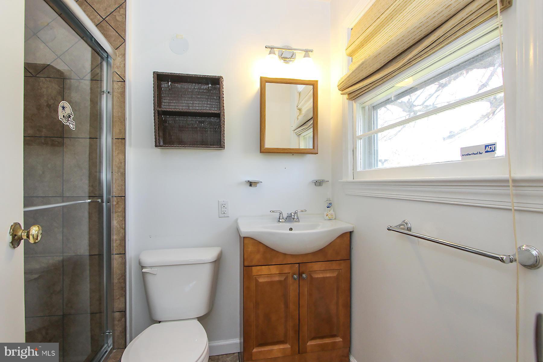 20820 Slidell Road Boyds, MD 20841 - Photo 23 of 29 a white toilet sitting next to a bathroom sink