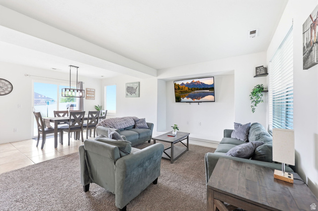 5485 Heather Way Tooele, UT 84074 - Photo 15 of 41 Open-concept living area featuring a neutral color palette