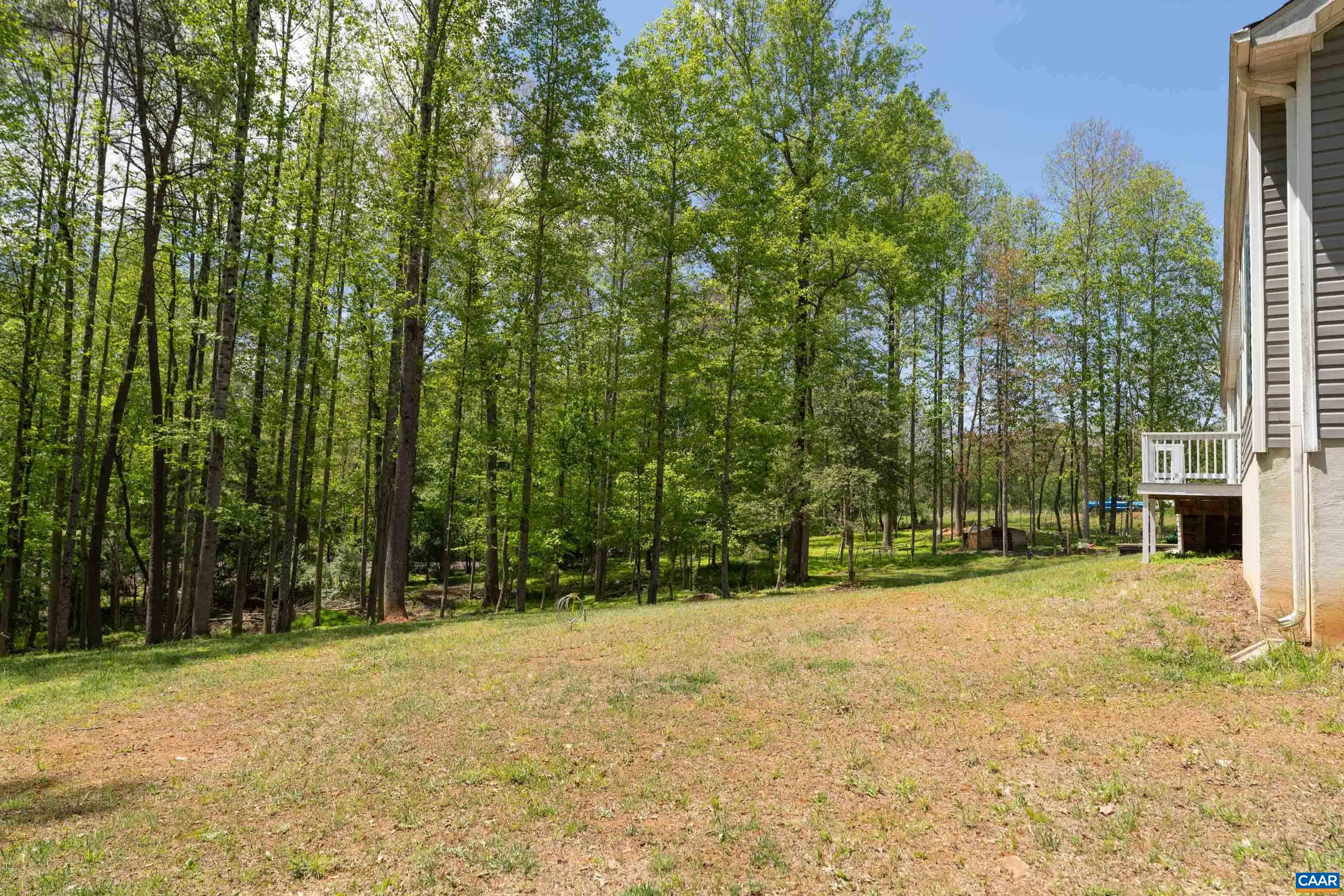 2441 Tisdale Road Barboursville, VA 22923 - Photo 39 of 44 back of house and run in shed and fenced for animals horses chickens goats whats your pleasure one floor living and oversized garage. 5 acres separate but part of 10 acres you could use for hunting. Orange & albemarle county. Unique home priced sell