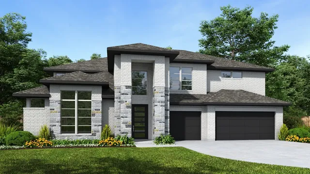 a front view of a house with a garden and yard