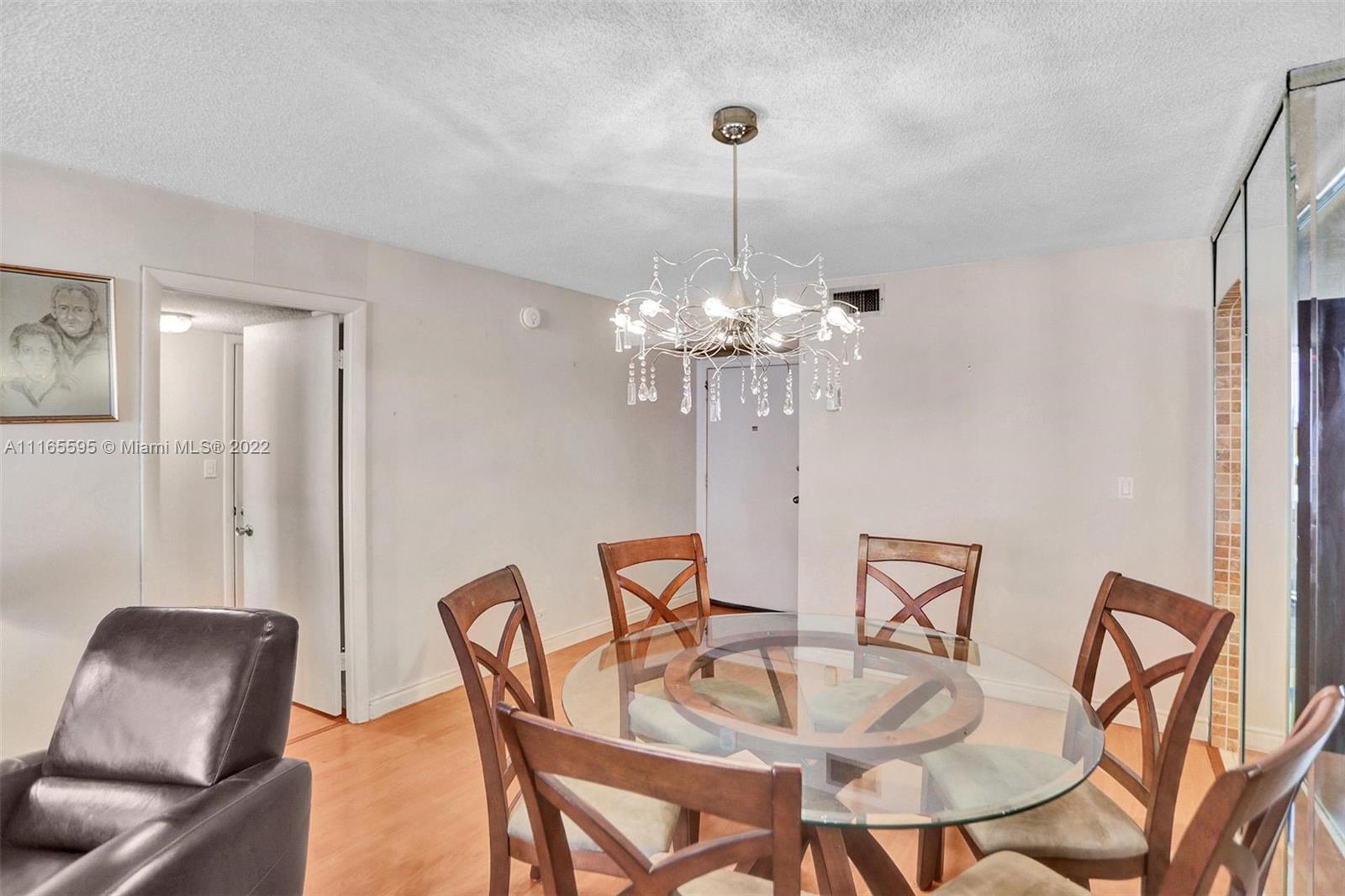 Millionaire's Row Miami Beach, FL 33140 - Photo 12 of 41 a view of a dining room with furniture and chandelier