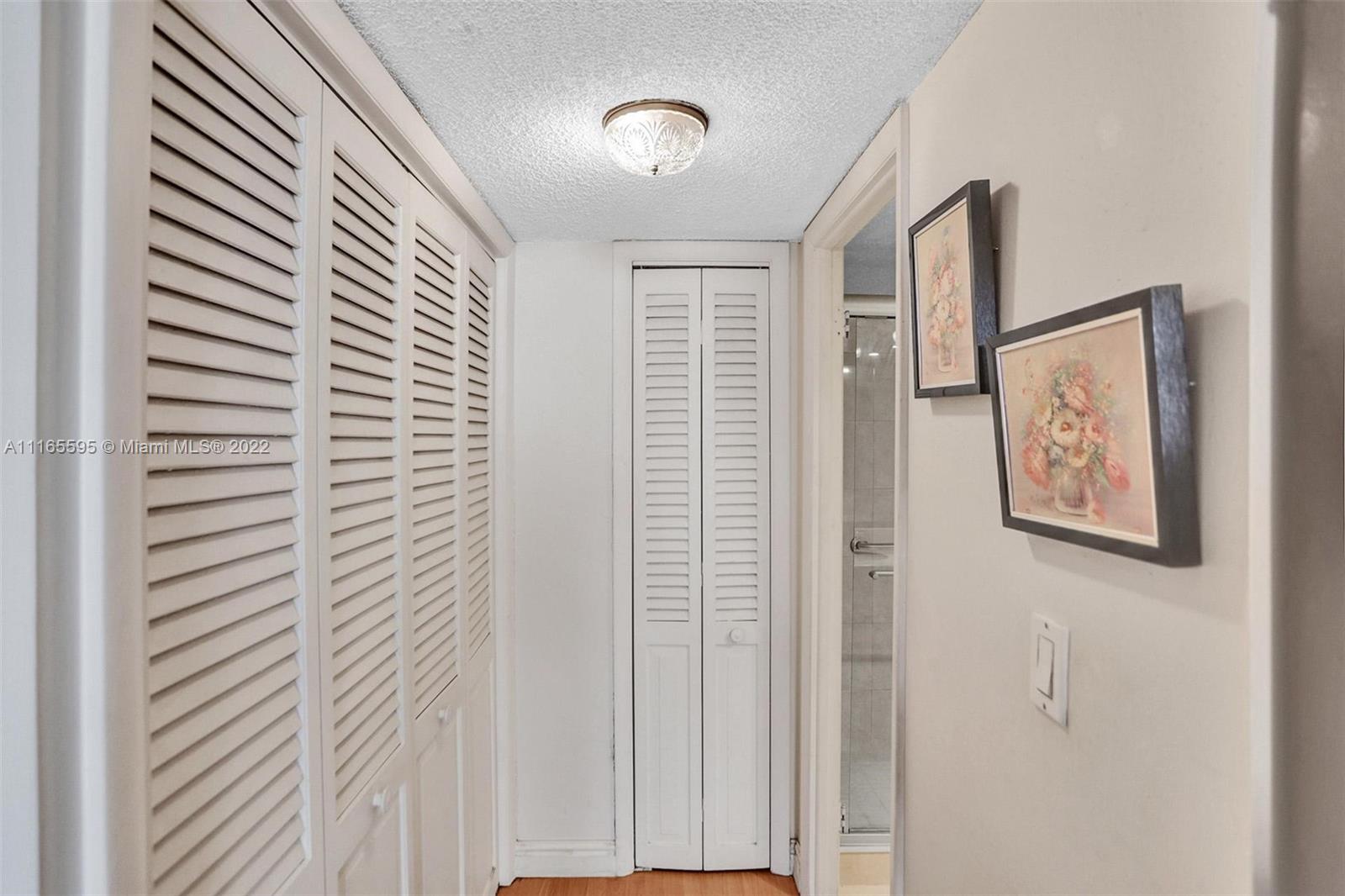 Millionaire's Row Miami Beach, FL 33140 - Photo 21 of 41 a view of a hallway with paintings on the wall