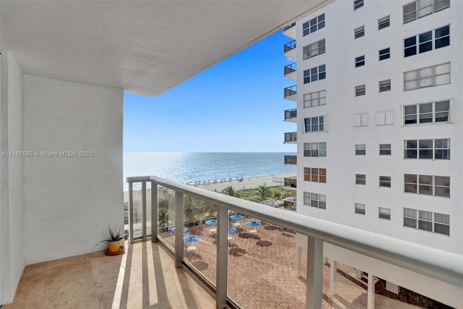 Millionaire's Row Miami Beach, FL 33140 - Photo 24 of 41 a view of a balcony with wooden floor and fence