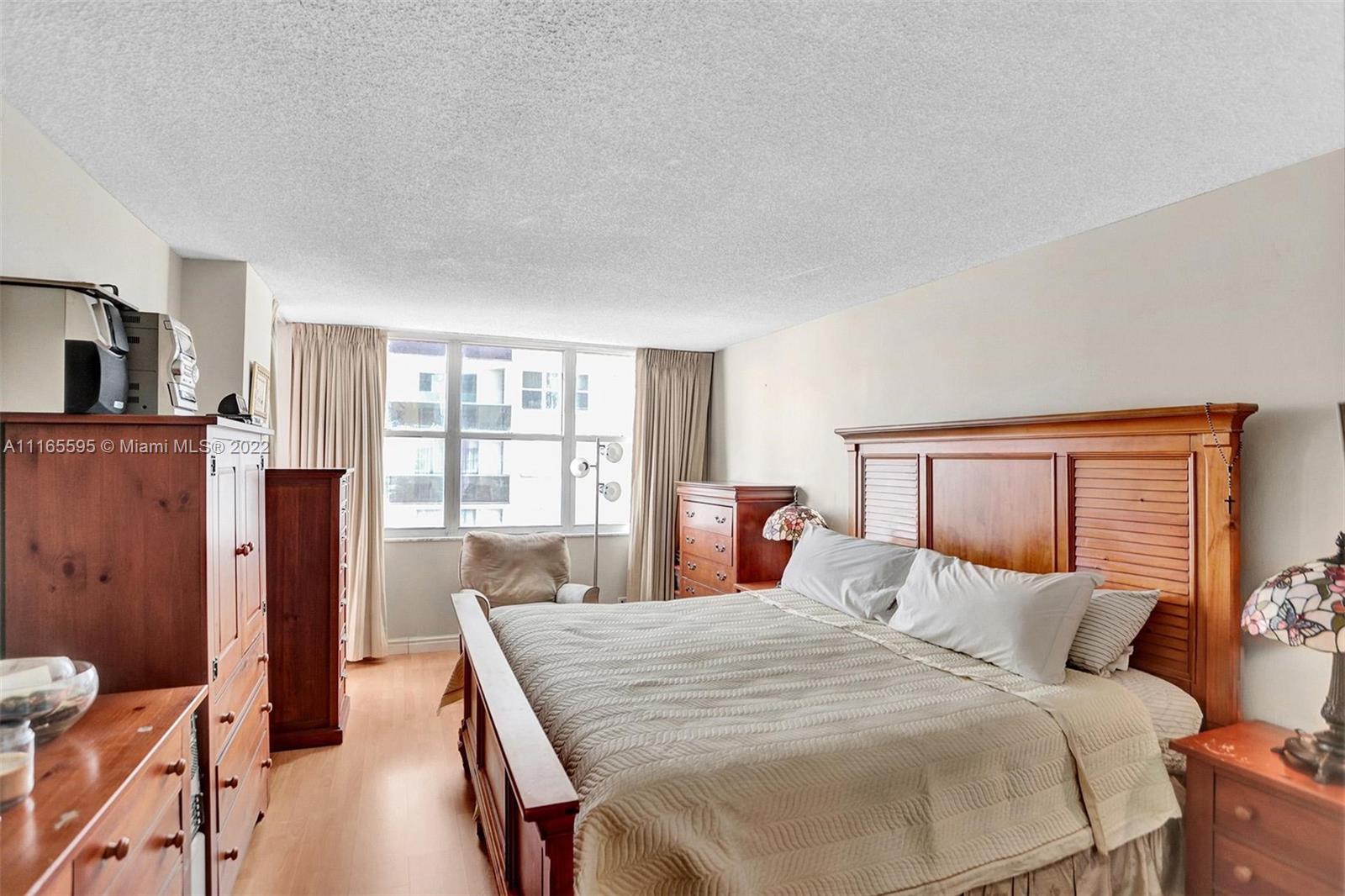 Millionaire's Row Miami Beach, FL 33140 - Photo 30 of 41 a bed room with a bed and a large window