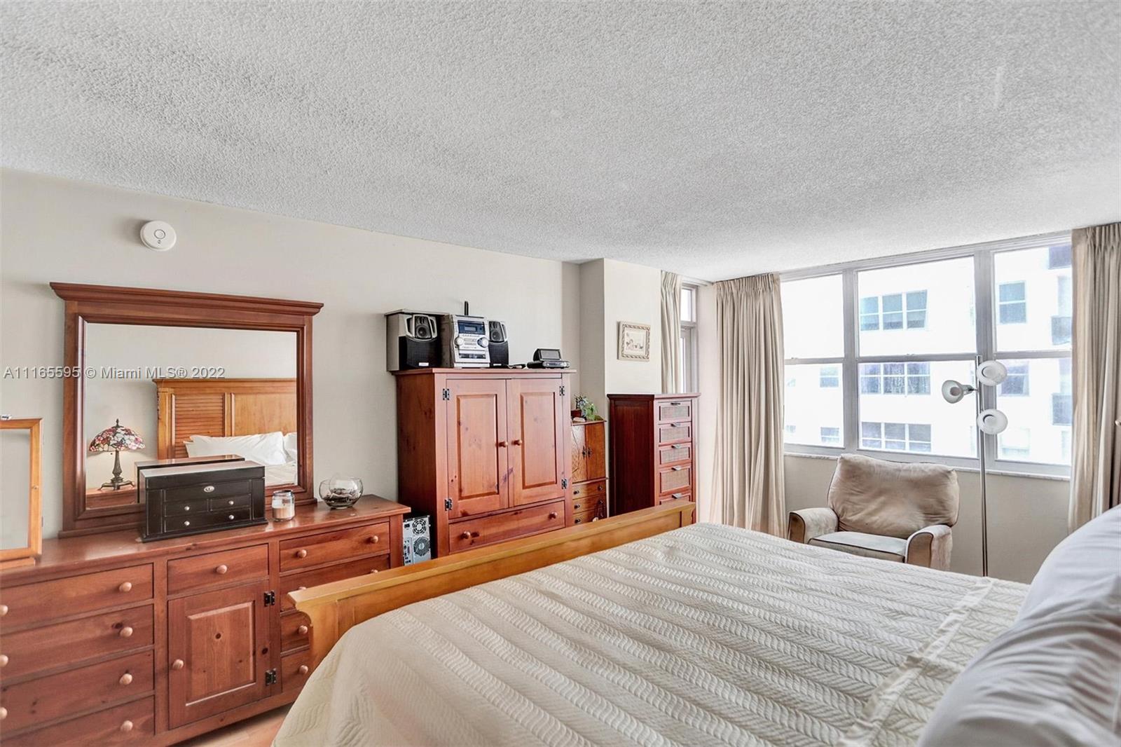 Millionaire's Row Miami Beach, FL 33140 - Photo 31 of 41 a bedroom with a large bed and a large mirror