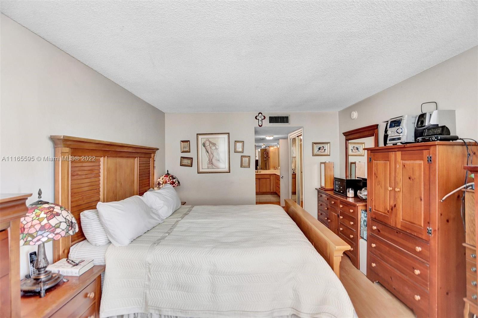 Millionaire's Row Miami Beach, FL 33140 - Photo 33 of 41 a large bedroom with a bed and wooden floor